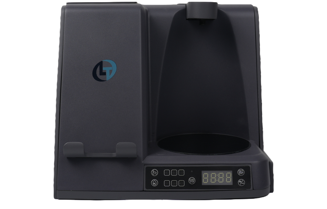 Front view of BrewBase showing its dispenser, mug pad, charging area and clock